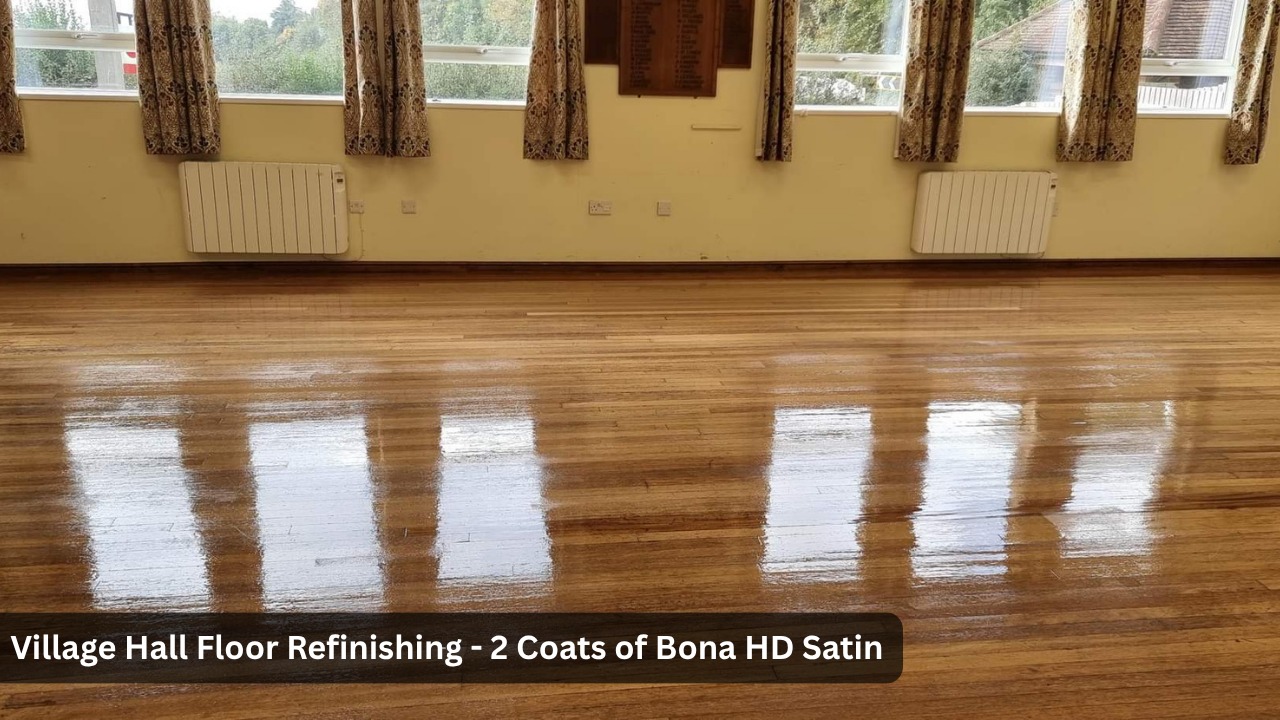 Village hall wooden floor after professional refinishing with 2 coats of Bona HD Satin lacquer showing a smooth, highly reflective finish